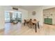 Cozy living area featuring ample natural light, comfortable seating, and an adjacent dining space at 4616 Leeta Ln, Sarasota, FL 34234