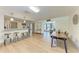Spacious living area with an open layout, dining space and breakfast bar seating at 4616 Leeta Ln, Sarasota, FL 34234