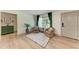 Comfortable sitting area with natural light, featuring neutral tones, textured rug and front door access at 4616 Leeta Ln, Sarasota, FL 34234