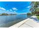 Scenic waterfront view featuring clear blue skies, calm water, and charming waterfront homes on a sunny day at 4616 Leeta Ln, Sarasota, FL 34234