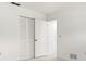 Bedroom with white walls, closet, and a door to another room for easy access at 465 Laurencin Dr, Nokomis, FL 34275