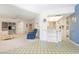 Open-concept living room connecting seamlessly to the kitchen and dining areas at 465 Laurencin Dr, Nokomis, FL 34275