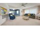 Inviting living room with comfortable seating, a pass-through window, and plenty of natural light at 465 Laurencin Dr, Nokomis, FL 34275