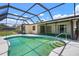 Enclosed pool with a view of the sky and a staircase leading into the water at 465 Laurencin Dr, Nokomis, FL 34275
