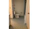 Clean bathroom with a tiled floor, a standard toilet, and an enclosed shower area at 512 W Venice Ave # 205, Venice, FL 34285