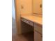 Bathroom vanity with drawers, cabinets, and a mirror above the vanity at 512 W Venice Ave # 205, Venice, FL 34285