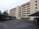 Low angle view of a condo building showing the parking area and the balconies at 512 W Venice Ave # 205, Venice, FL 34285