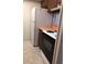Small kitchen with brown cabinets, white countertops, and white appliances at 512 W Venice Ave # 205, Venice, FL 34285