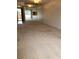 A vacant living room with sliding glass doors that lead to a balcony at 512 W Venice Ave # 205, Venice, FL 34285