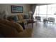 Relaxing community lounge with comfortable seating, a table, and natural light from large windows at 512 W Venice Ave # 205, Venice, FL 34285