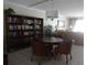 Community space featuring bookshelves, a table with chairs, and comfortable seating area at 512 W Venice Ave # 205, Venice, FL 34285