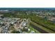 Aerial view of the neighborhood and home near a serene waterway and local amenities at 552 Bellaire Dr, Venice, FL 34293