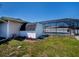 Backyard with screened in pool area and storage shed at 552 Bellaire Dr, Venice, FL 34293