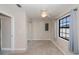 Bedroom featuring neutral carpet, sliding mirror closet doors and a window with curtains at 552 Bellaire Dr, Venice, FL 34293