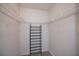 Walk-in closet equipped with wire shelving and a shoe rack for optimal storage at 552 Bellaire Dr, Venice, FL 34293
