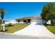 Inviting single-story home with an extended driveway and a freshly landscaped yard at 552 Bellaire Dr, Venice, FL 34293