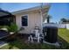 Exterior view of a well-maintained home featuring AC unit and pool equipment at 552 Bellaire Dr, Venice, FL 34293