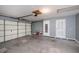 Spacious two car garage with access doors and shelving at 552 Bellaire Dr, Venice, FL 34293