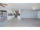 Open concept living room with lots of natural light and a view into the kitchen at 552 Bellaire Dr, Venice, FL 34293