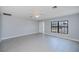 Expansive living room featuring tile flooring, neutral paint, and an abundance of natural light at 552 Bellaire Dr, Venice, FL 34293