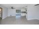 Bright, open floor plan boasts tile floors, ceiling fan and sliding glass doors that lead out to the pool at 552 Bellaire Dr, Venice, FL 34293