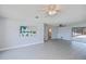Bright living room featuring tile flooring, a ceiling fan, and access to the backyard pool at 552 Bellaire Dr, Venice, FL 34293