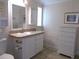 Bathroom featuring single sink vanity, a medicine cabinet, and extra dresser storage at 554 Aspen Ave, Venice, FL 34285