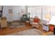 Bright living room featuring hardwood floors, white walls, and large windows with natural light at 554 Aspen Ave, Venice, FL 34285