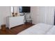 Bedroom with a large dresser, TV and closet at 554 Aspen Ave, Venice, FL 34285