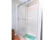 Bathroom showcasing standing shower with glass doors and a built-in bench at 554 Aspen Ave, Venice, FL 34285