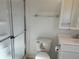 Clean bathroom with updated toilet and sleek vanity providing ample space for daily needs at 56 Lakeview Dr, North Port, FL 34287