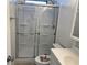 Bathroom with a glass door shower and decorative toilet seat at 56 Lakeview Dr, North Port, FL 34287