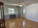 Inviting living room with wood-look floors, built-in storage, and a neutral color palette at 56 Lakeview Dr, North Port, FL 34287
