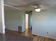 View of the living room and hallway featuring wood-look flooring and neutral wall paint at 56 Lakeview Dr, North Port, FL 34287