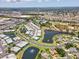 Expansive aerial view showcases the beautiful community, complete with serene lakes and lush greenery at 5739 Sabal Trace Dr # 102, North Port, FL 34287