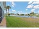 Spacious backyard with a scenic pond view and lush greenery, perfect for outdoor relaxation at 5739 Sabal Trace Dr # 102, North Port, FL 34287