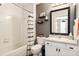 Well-lit bathroom featuring tub and shower, modern fixtures, and stylish decor, designed for comfort at 5739 Sabal Trace Dr # 102, North Port, FL 34287