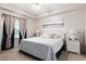 Serene bedroom with soft lighting, comfortable bedding, and elegant decor, promoting relaxation at 5739 Sabal Trace Dr # 102, North Port, FL 34287