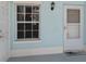 Exterior shot shows a door with a window and another door with a knob and a window at 5739 Sabal Trace Dr # 102, North Port, FL 34287