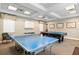 Entertaining game room featuring a pool table and a ping pong table at 5739 Sabal Trace Dr # 102, North Port, FL 34287