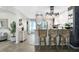 A modern kitchen with breakfast bar seating that opens to the adjacent living space at 5739 Sabal Trace Dr # 102, North Port, FL 34287
