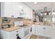 Bright white kitchen with modern appliances and an open layout to the living area at 5739 Sabal Trace Dr # 102, North Port, FL 34287