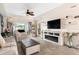 Bright living room with fireplace, modern furnishings, and ample natural light at 5739 Sabal Trace Dr # 102, North Port, FL 34287