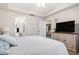 Spacious bedroom with large TV and ample natural light, perfect for a restful retreat at 5739 Sabal Trace Dr # 102, North Port, FL 34287