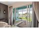 Serene screened patio with comfortable seating and a beautiful lake view at 5739 Sabal Trace Dr # 102, North Port, FL 34287