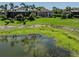 Expansive backyard with lush landscaping and water views, creating a serene outdoor space at 5853 Semolino St, Nokomis, FL 34275