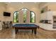 Community clubhouse with a pool table, kitchen area, and cozy seating arrangements at 5853 Semolino St, Nokomis, FL 34275
