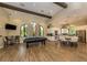 Spacious clubhouse featuring a pool table, kitchen area, and ample seating for residents at 5853 Semolino St, Nokomis, FL 34275