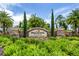 Elegant stone community entrance sign with lush landscaping and a welcoming atmosphere at 5853 Semolino St, Nokomis, FL 34275