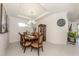 Elegant dining room with a chandelier, large table, and seating for eight at 5853 Semolino St, Nokomis, FL 34275